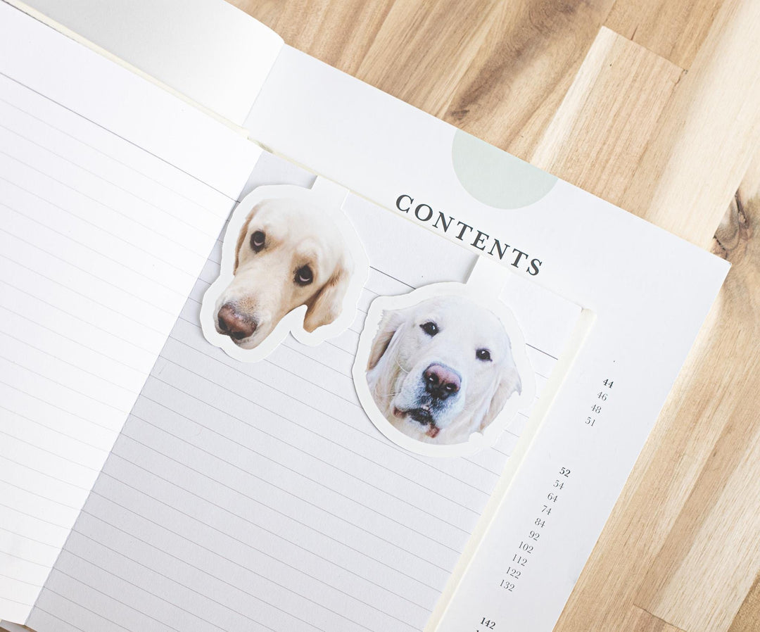 Custom dog photo magnetic bookmarks on an open book