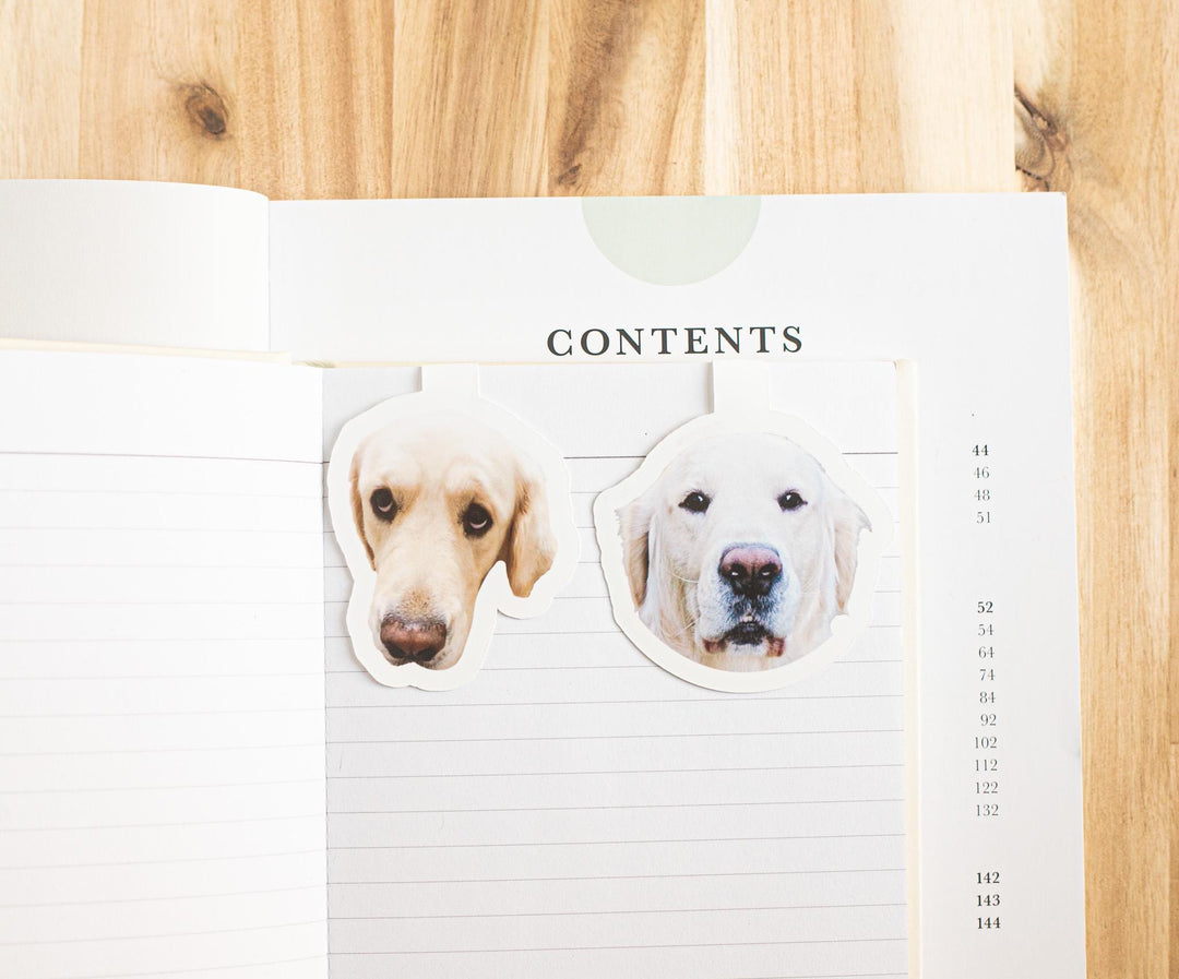 Custom dog photo magnetic bookmarks on an open book