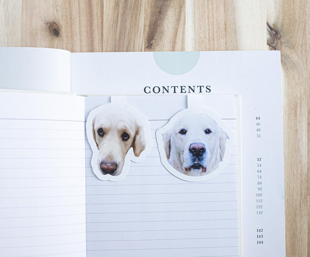 Custom dog photo magnetic bookmarks on an open book