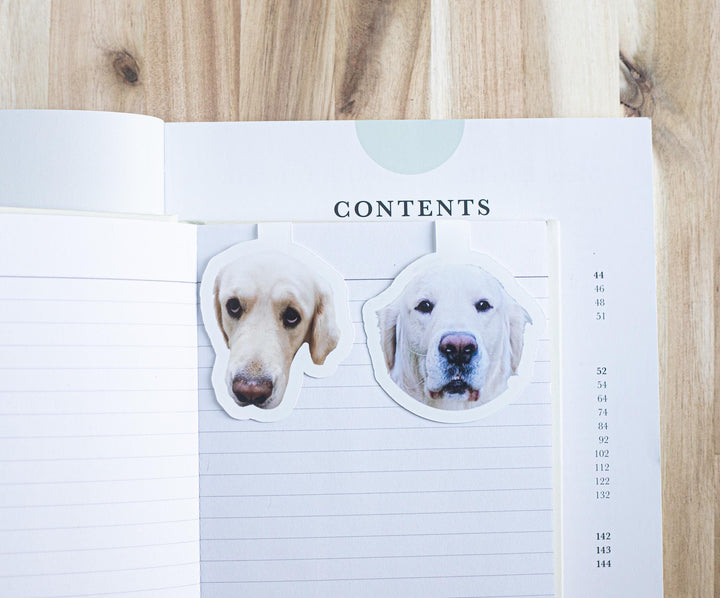 Custom dog photo magnetic bookmarks on an open book