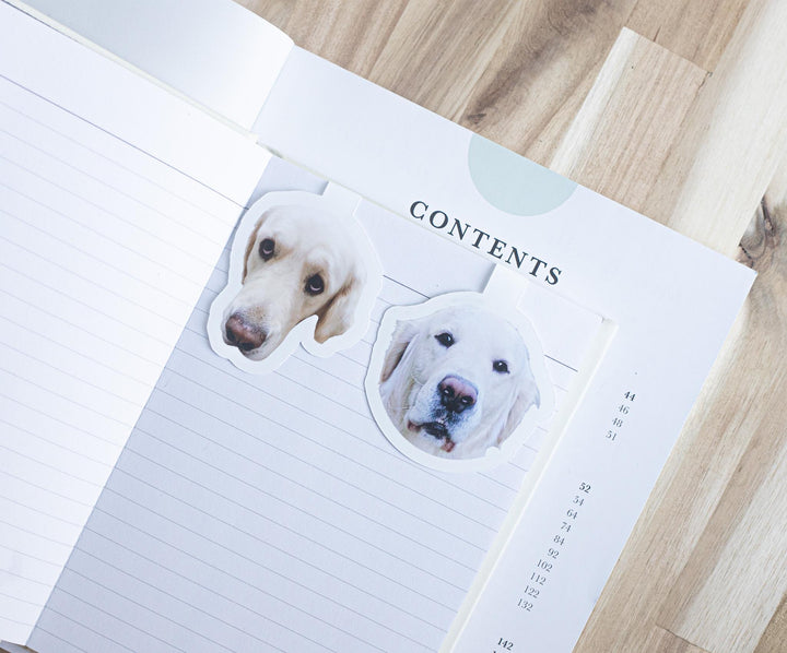 Custom dog photo magnetic bookmarks on an open book