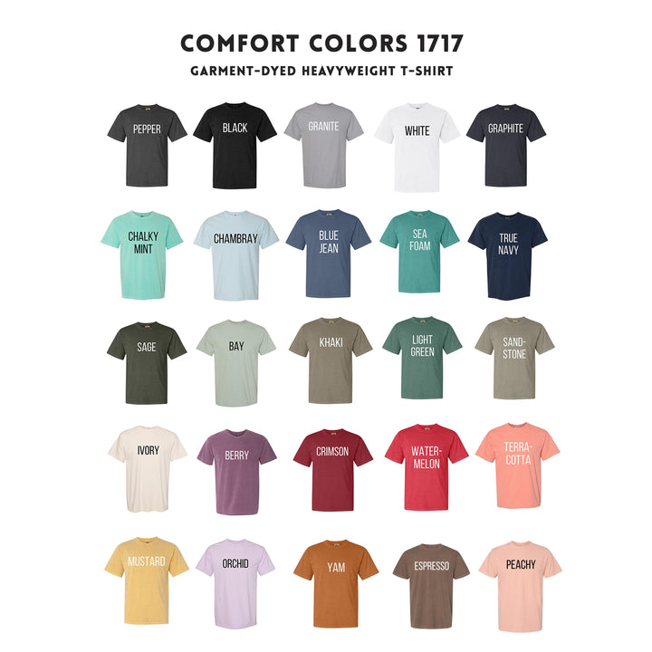 a bunch of different colors of t - shirts